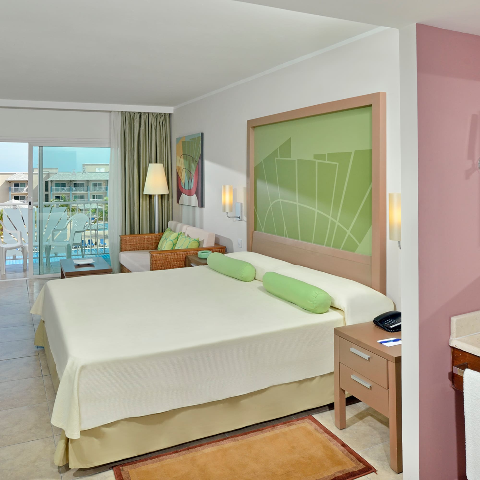 a room with a bed and a sink