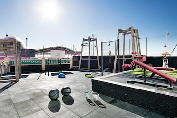 a rooftop with a playground equipment