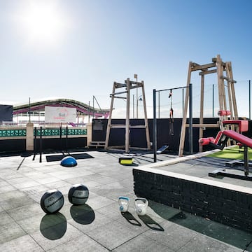 a rooftop with a playground equipment