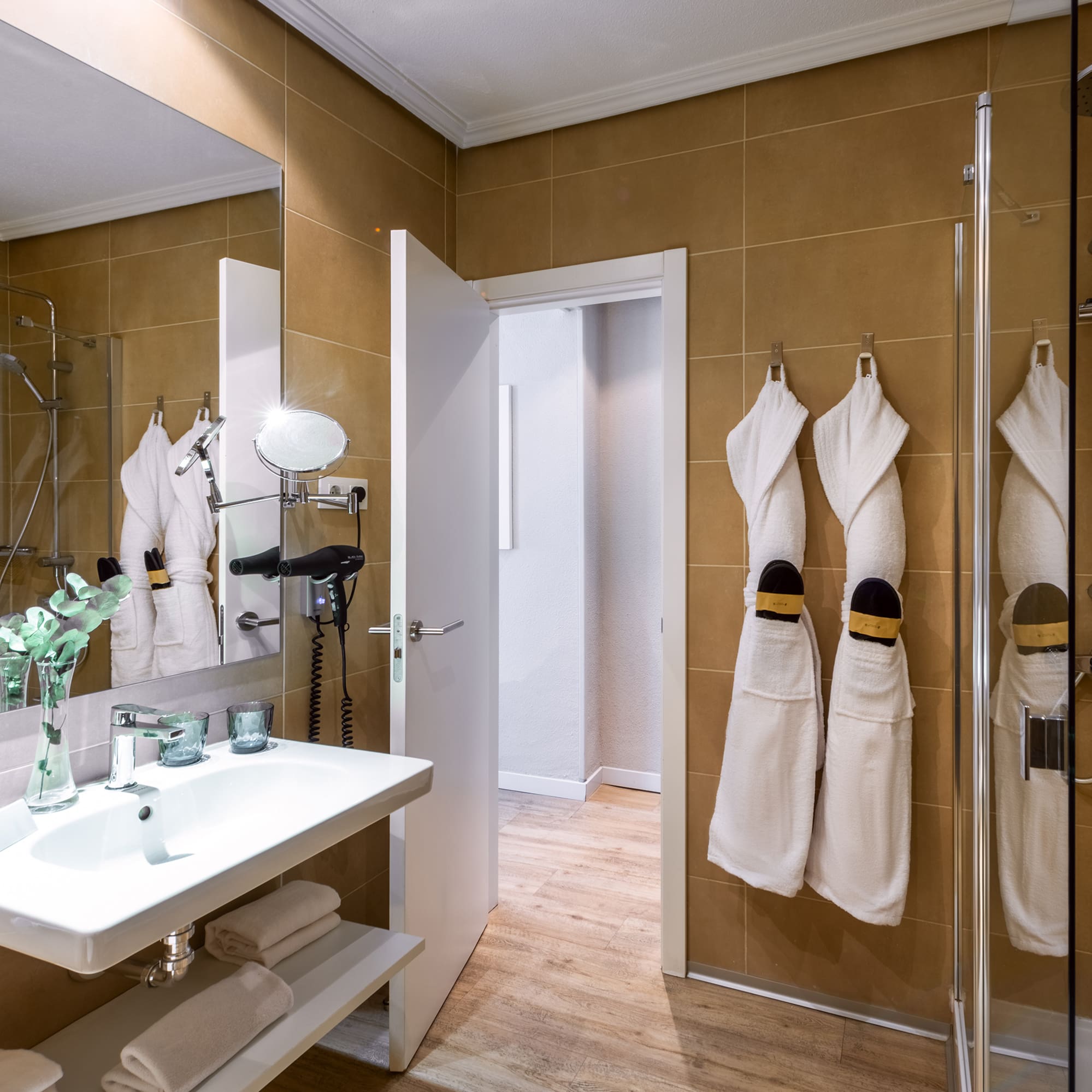 a bathroom with white towels on the wall