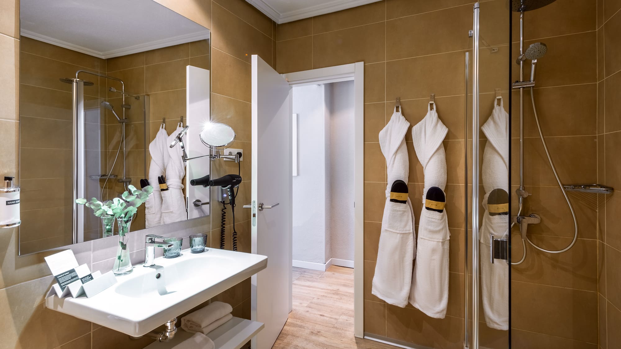 a bathroom with white towels on the wall