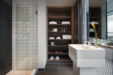 a bathroom with a sink and shelves