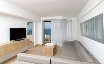 a living room with a television and a table