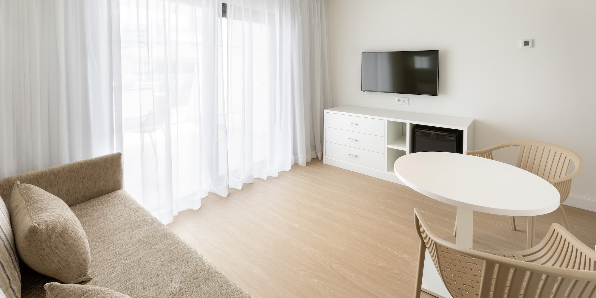 a living room with a tv and a couch