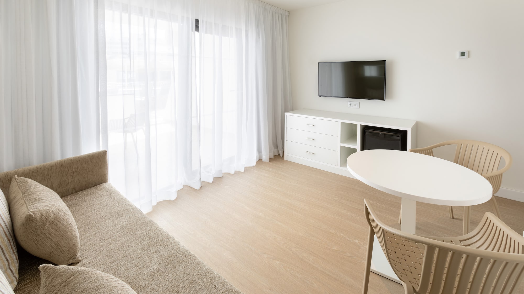 a living room with a tv and a couch