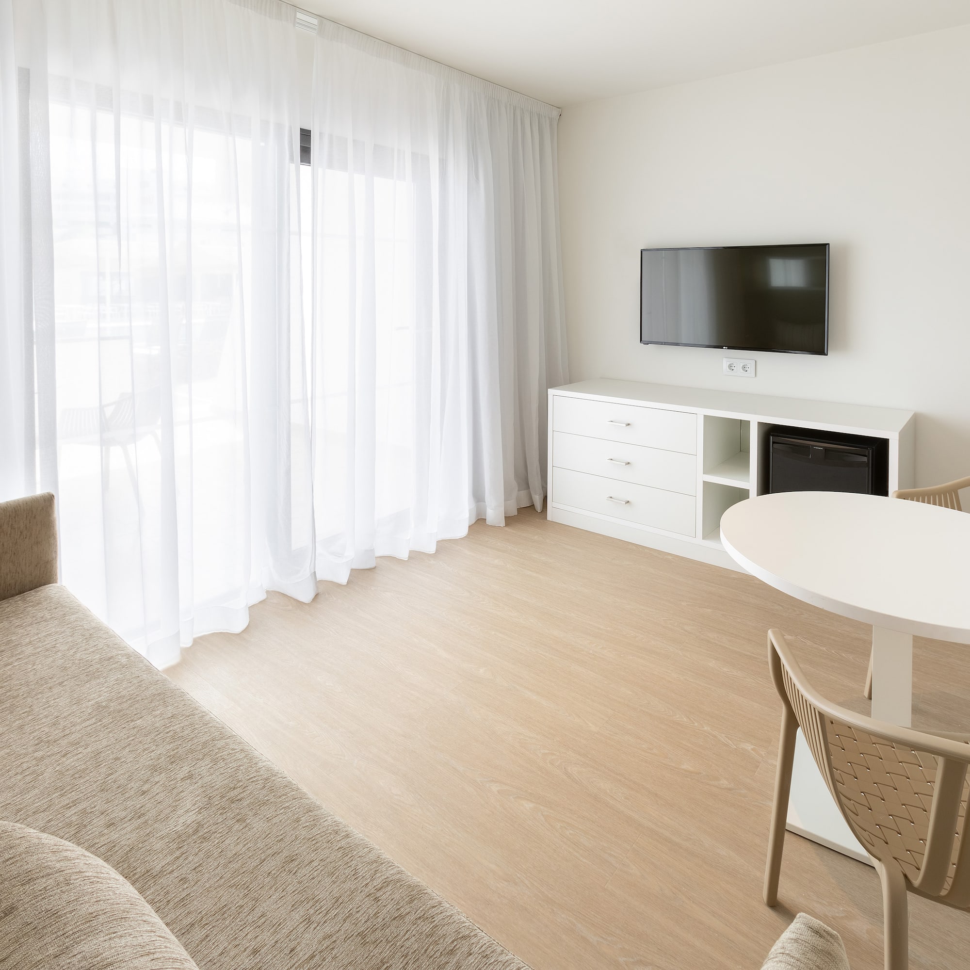 a living room with a tv and a couch