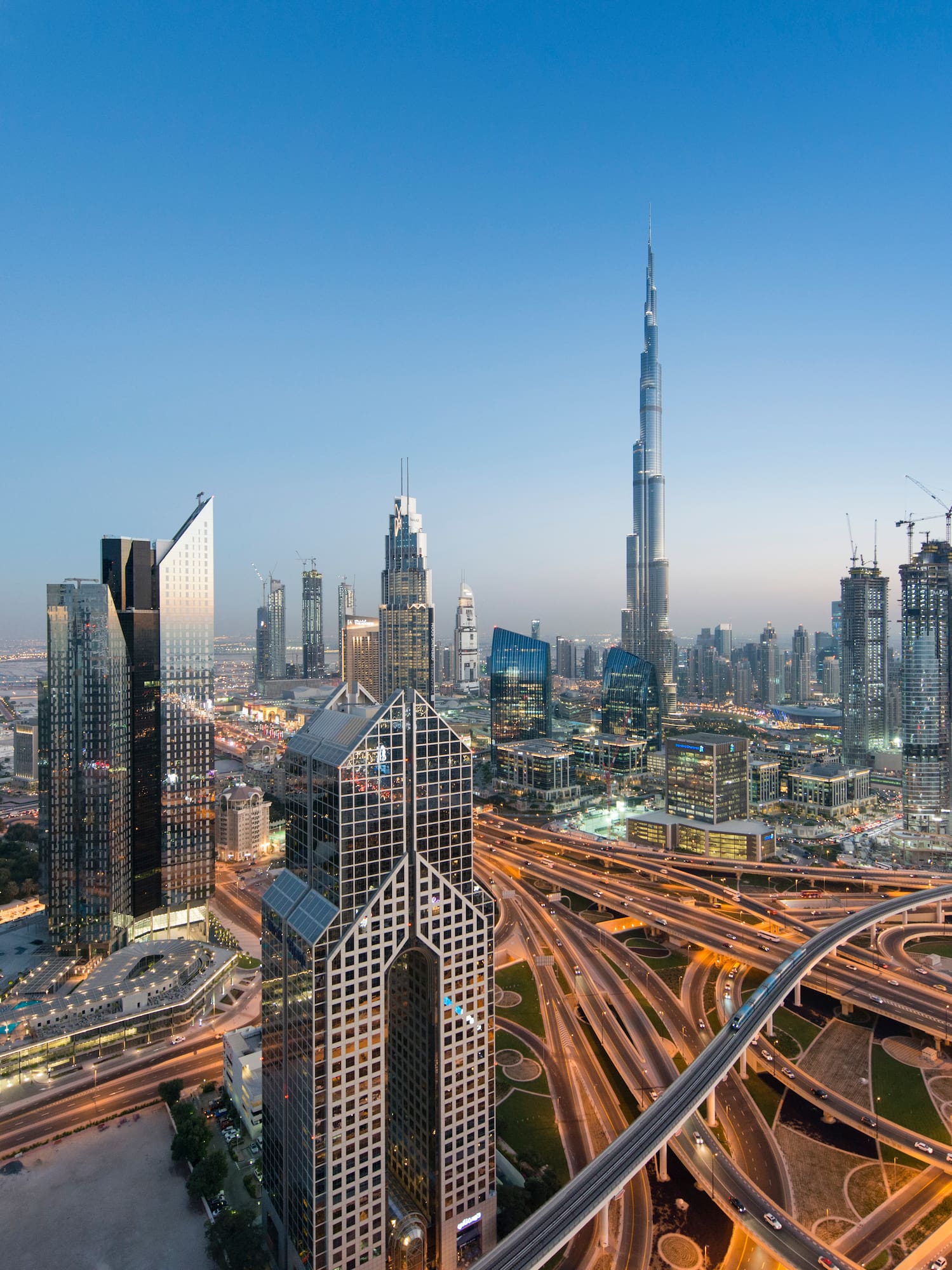 a city skyline with many roads and skyscrapers