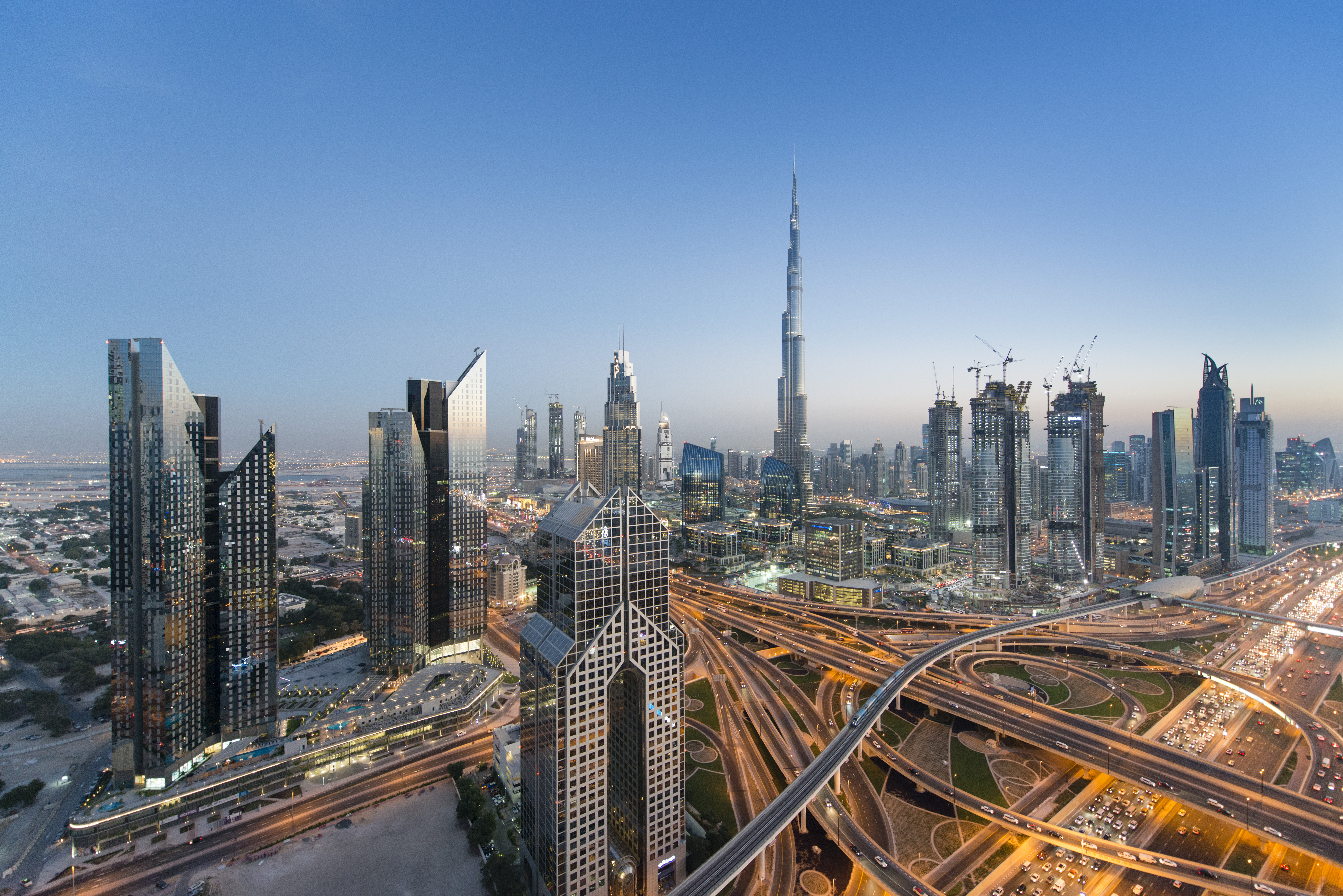 a city skyline with many roads and skyscrapers