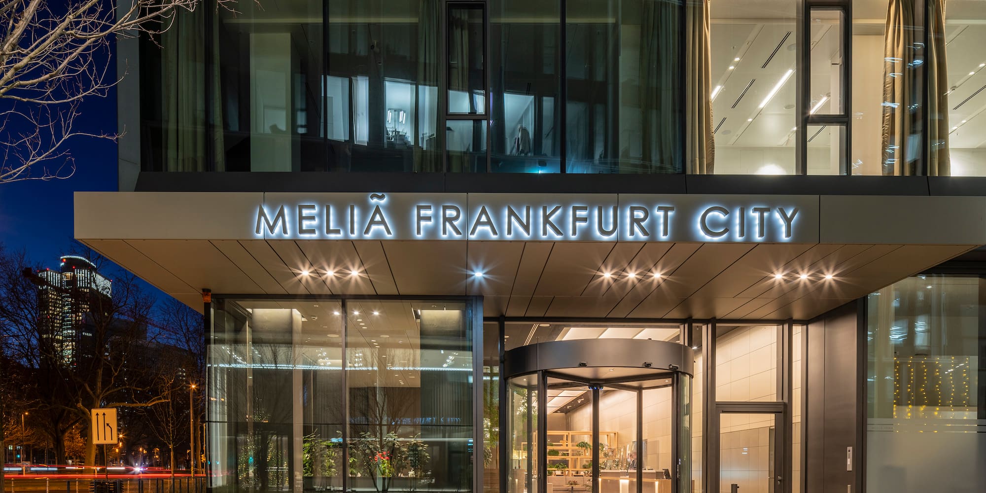 a building with glass doors and a sign