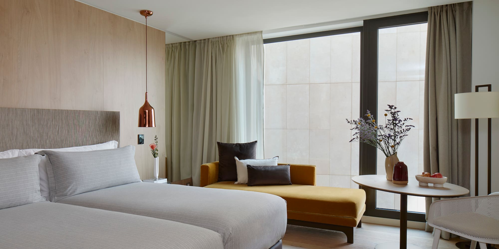 a room with two beds and a couch