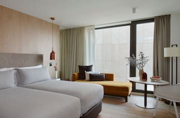 a room with two beds and a couch
