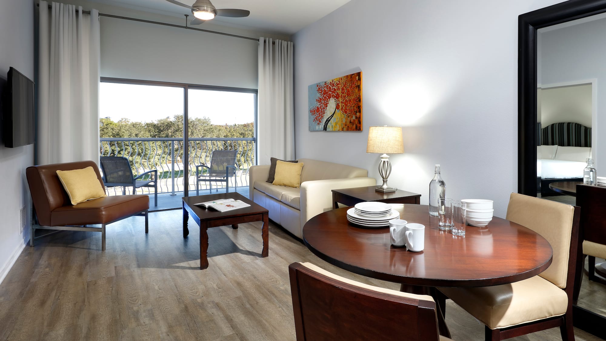 a living room with a table and chairs