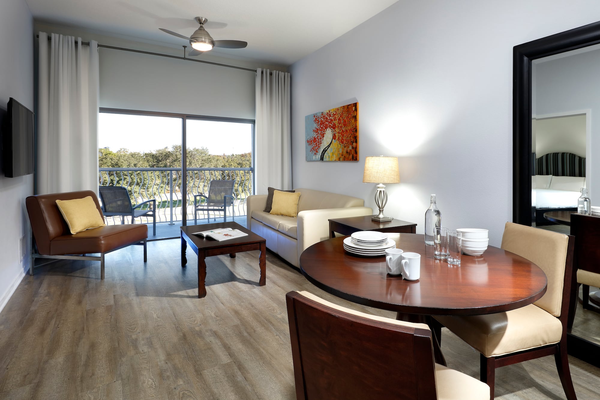a living room with a table and chairs