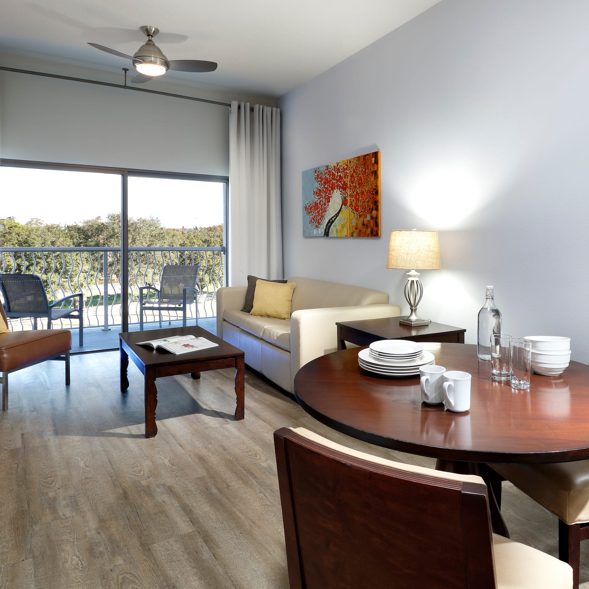 a living room with a table and chairs