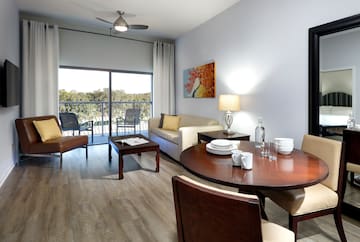 a living room with a table and chairs