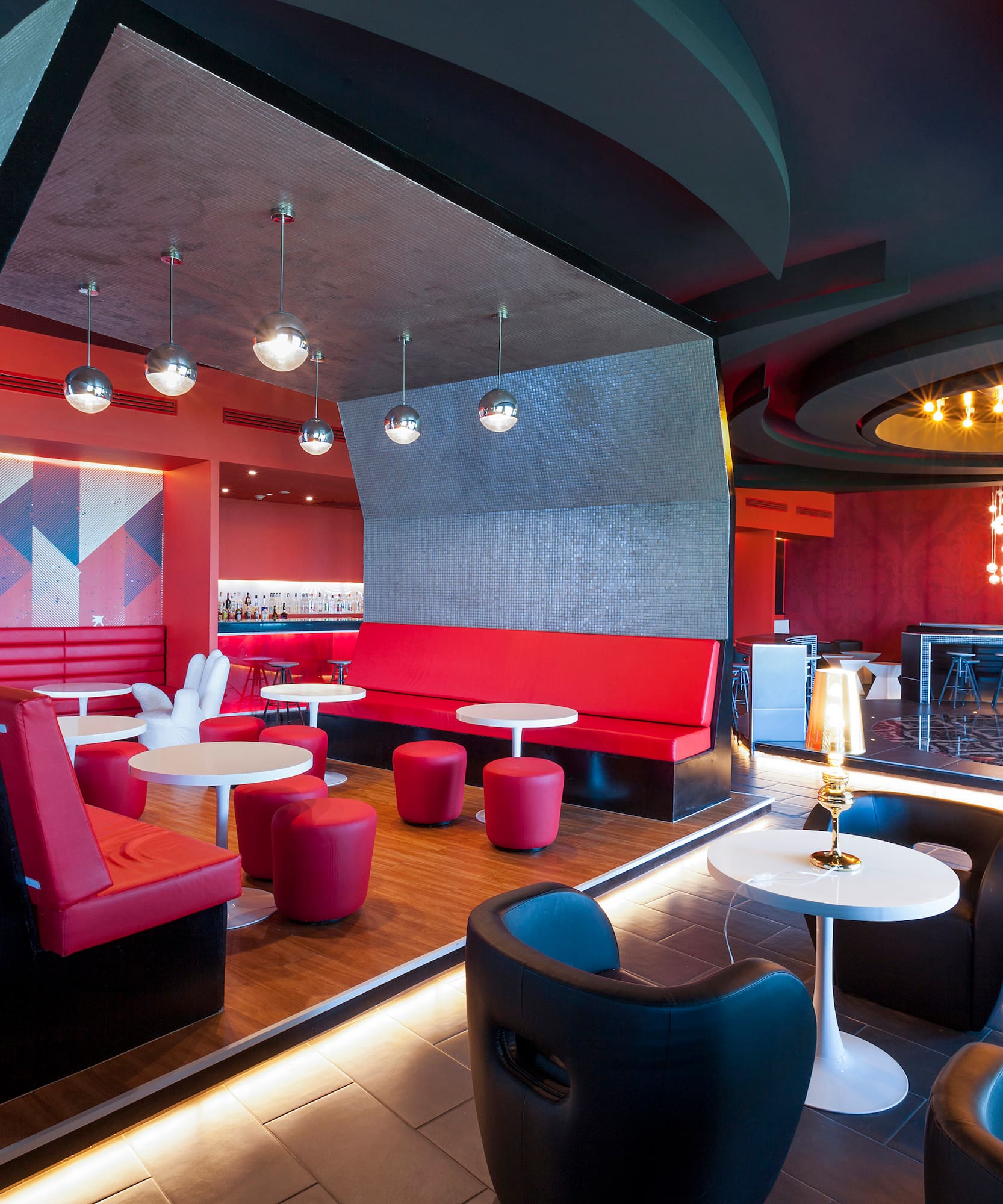 a room with red and black furniture