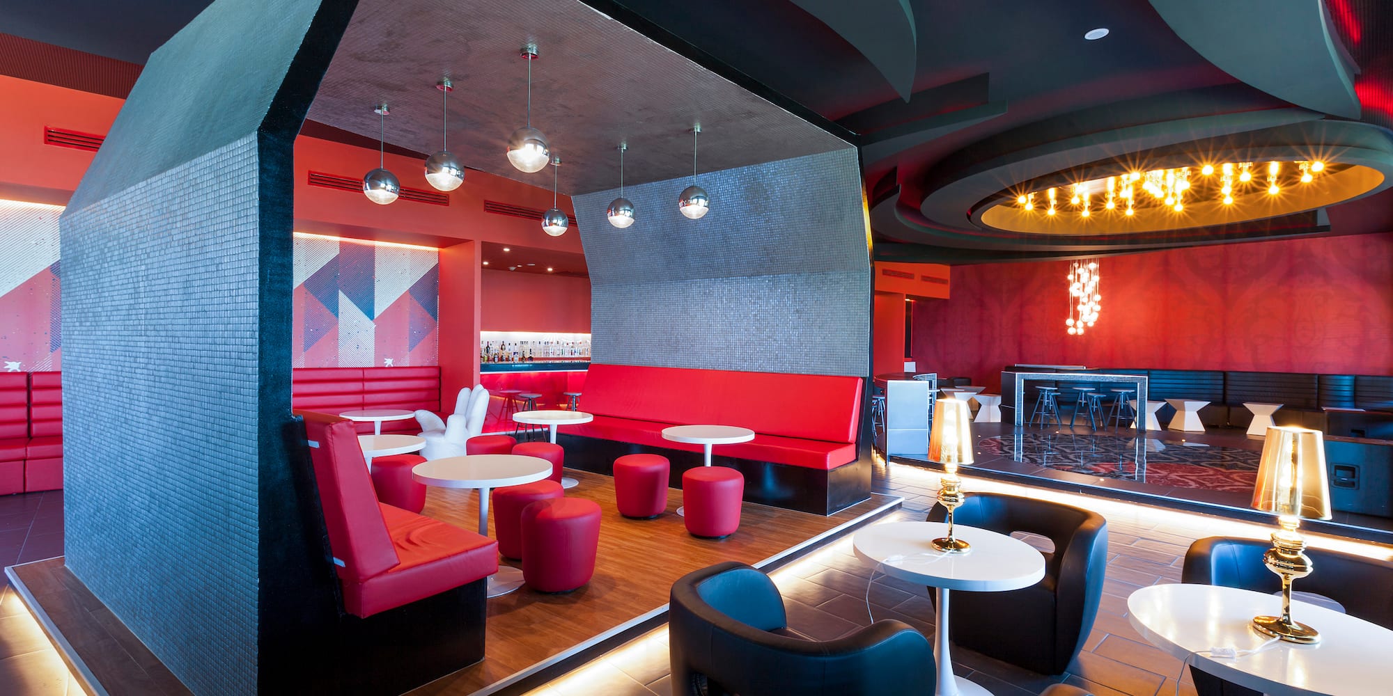 a room with red and black furniture