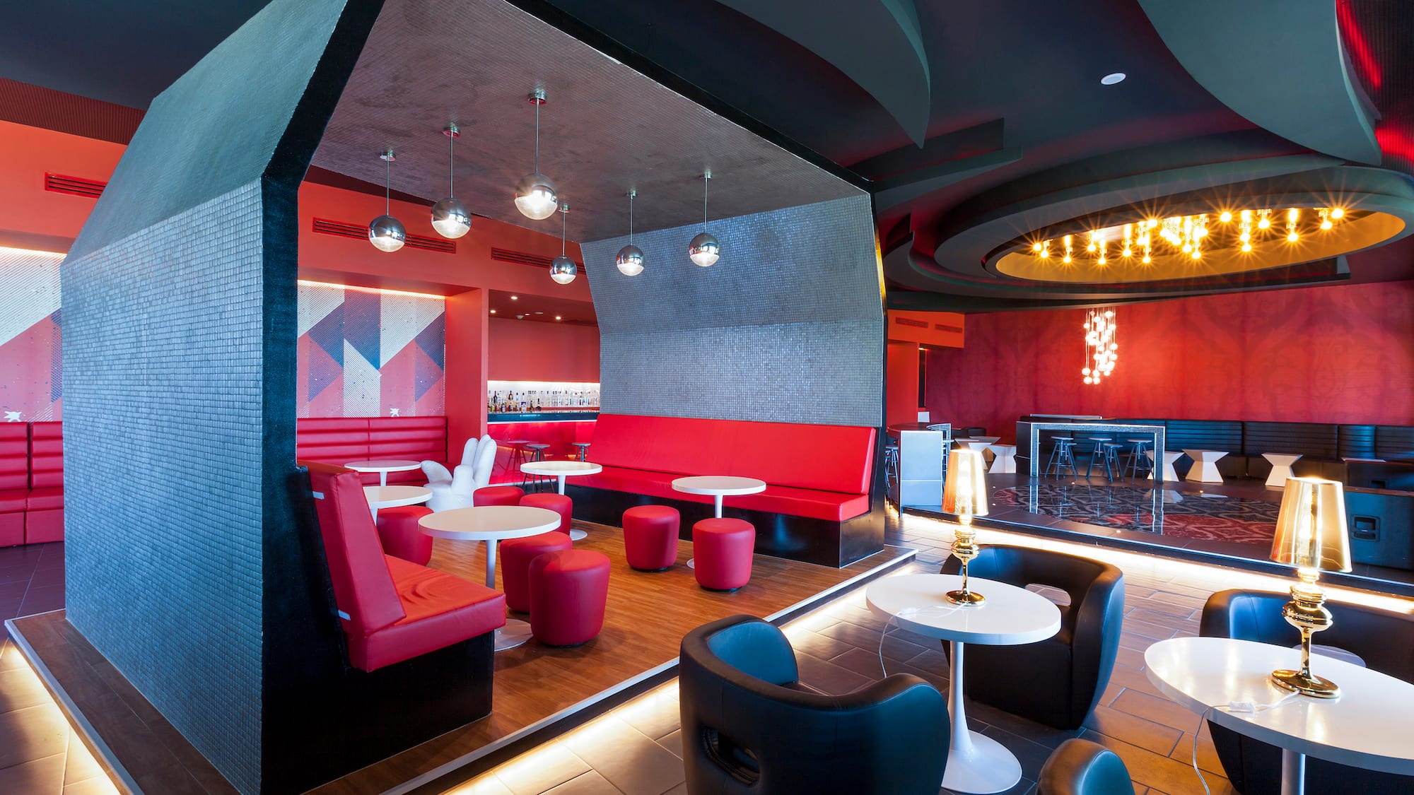 a room with red and black furniture