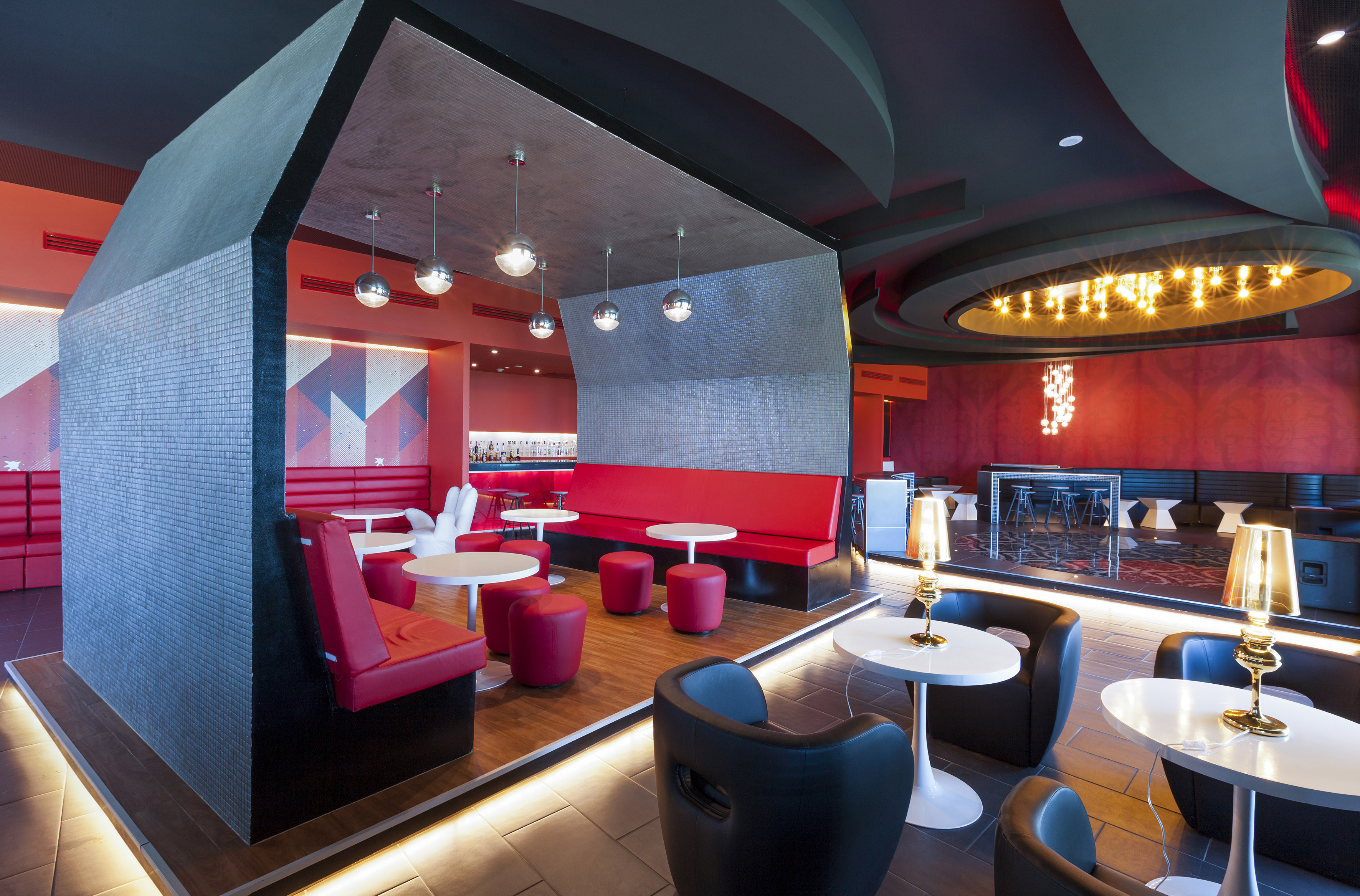 a room with red and black furniture