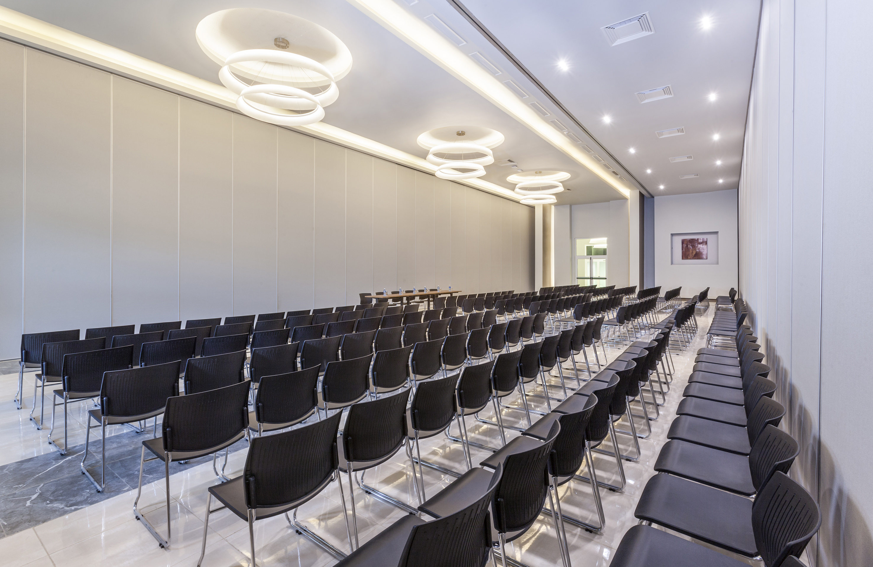 a room with rows of chairs