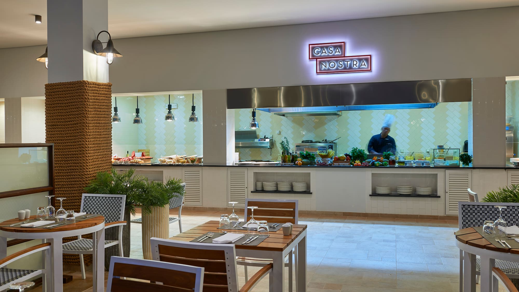 a restaurant with a chef cooking