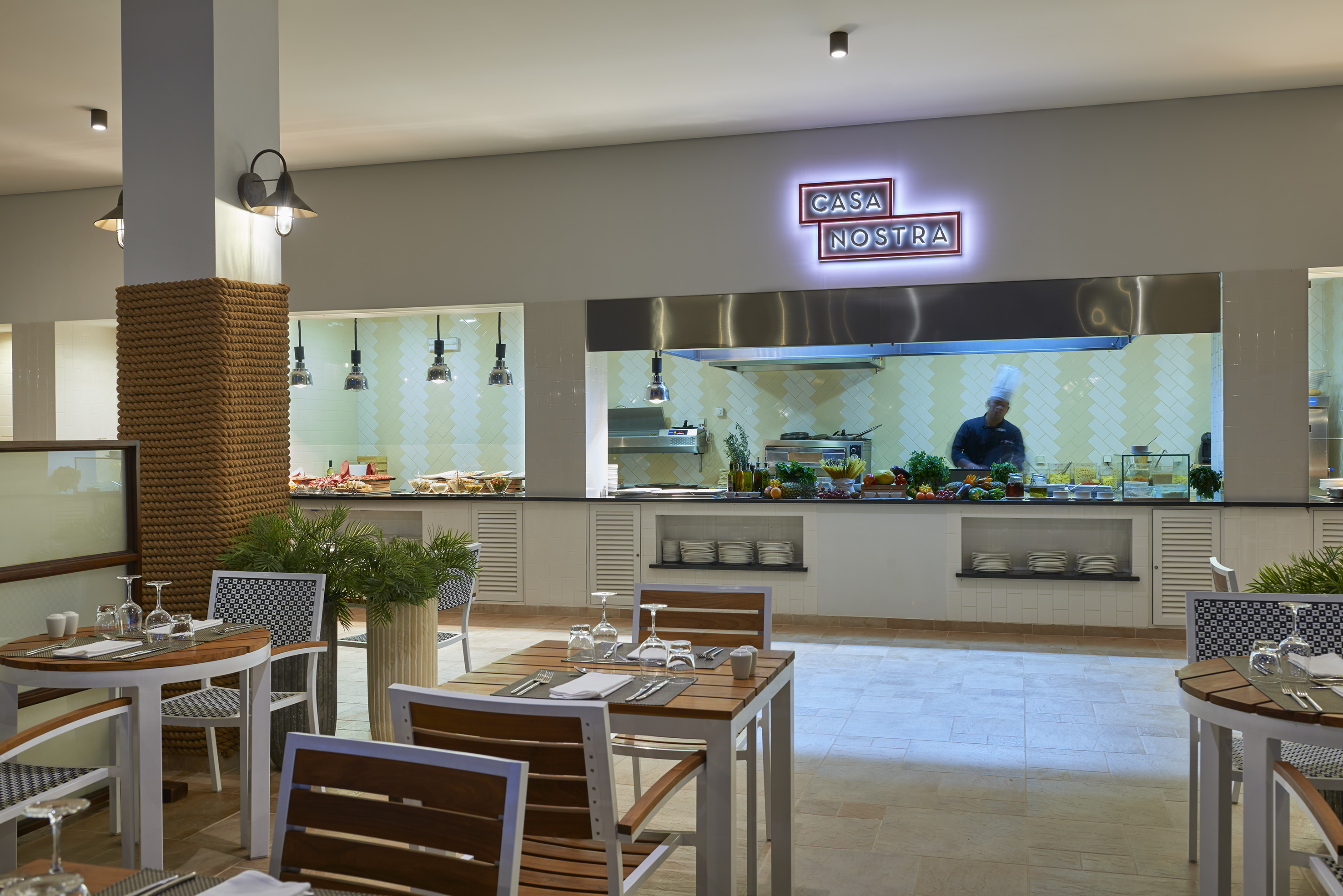 a restaurant with a chef cooking