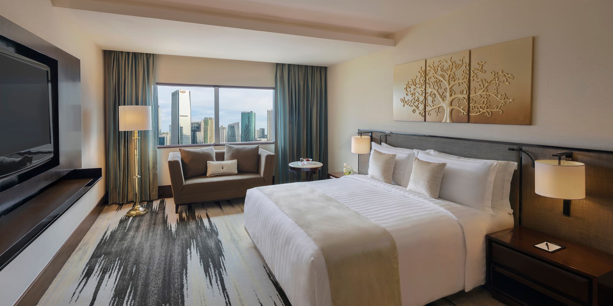 a hotel room with a bed and a couch