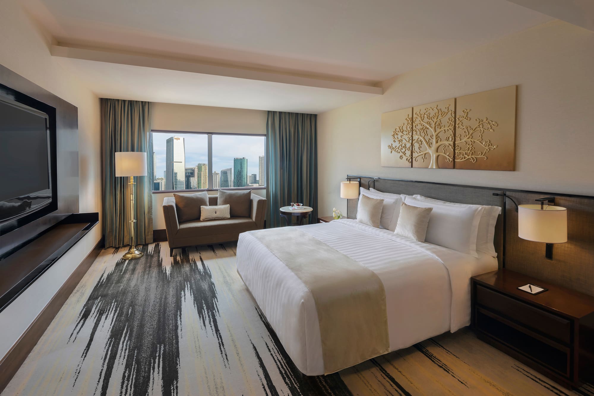 a hotel room with a bed and a couch