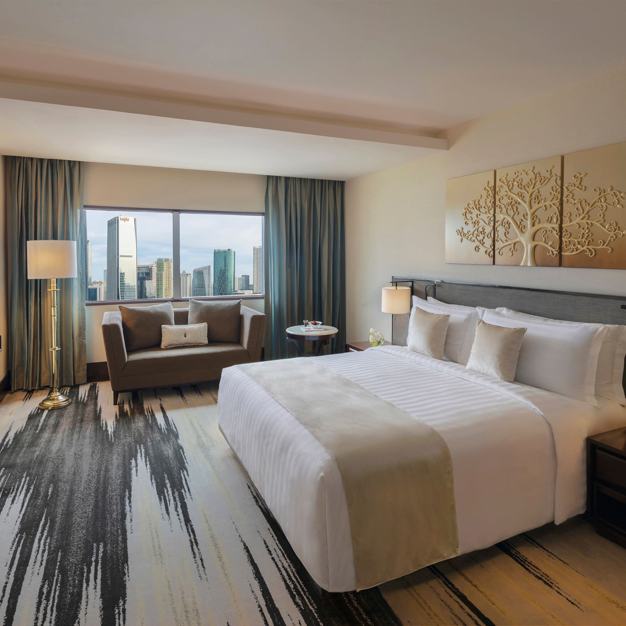 a hotel room with a bed and a couch