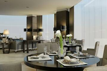 a room with a round table and chairs