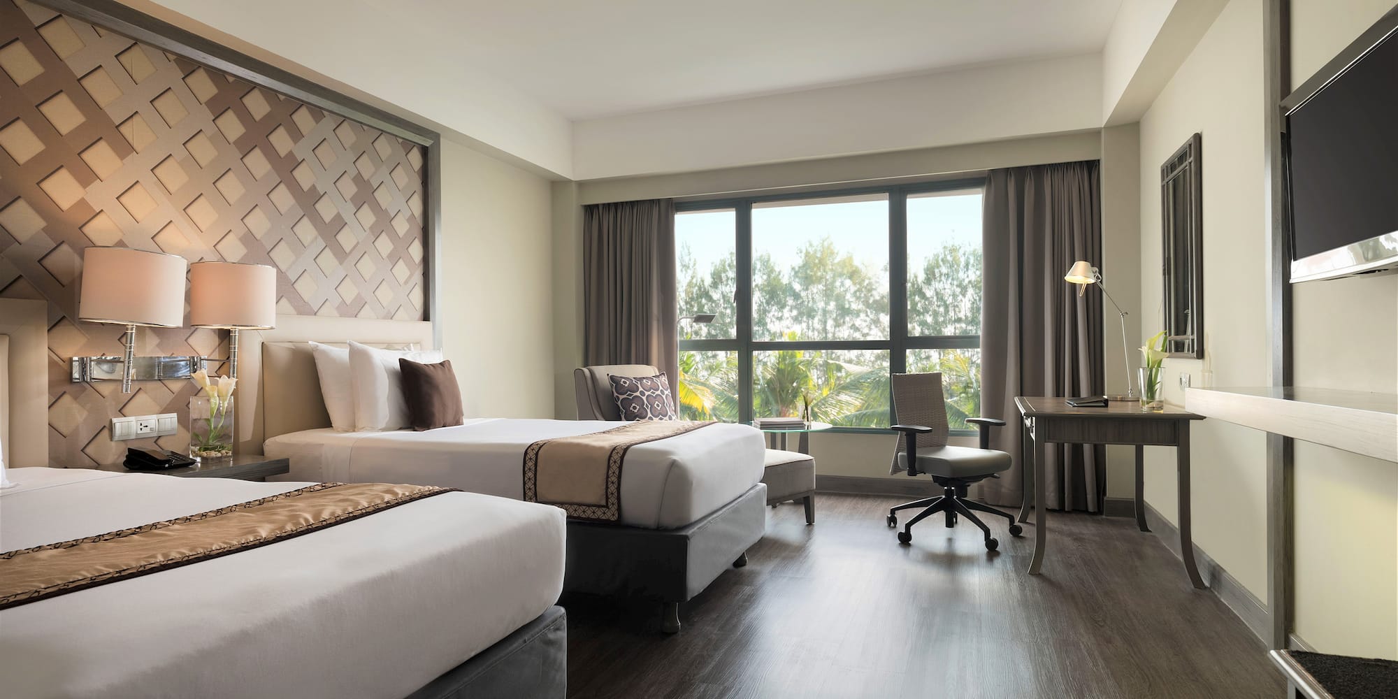 a room with two beds and a desk