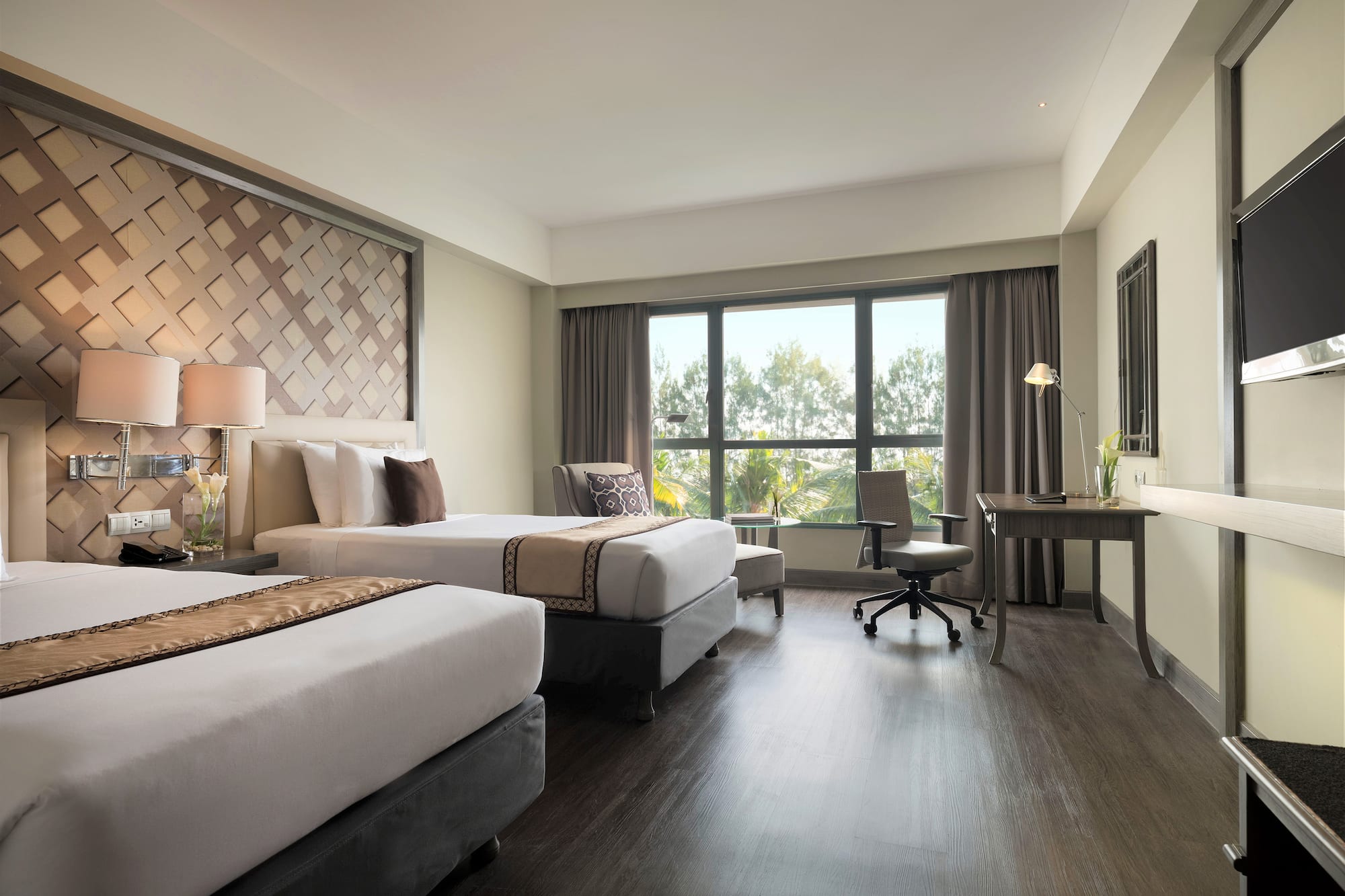 a room with two beds and a desk