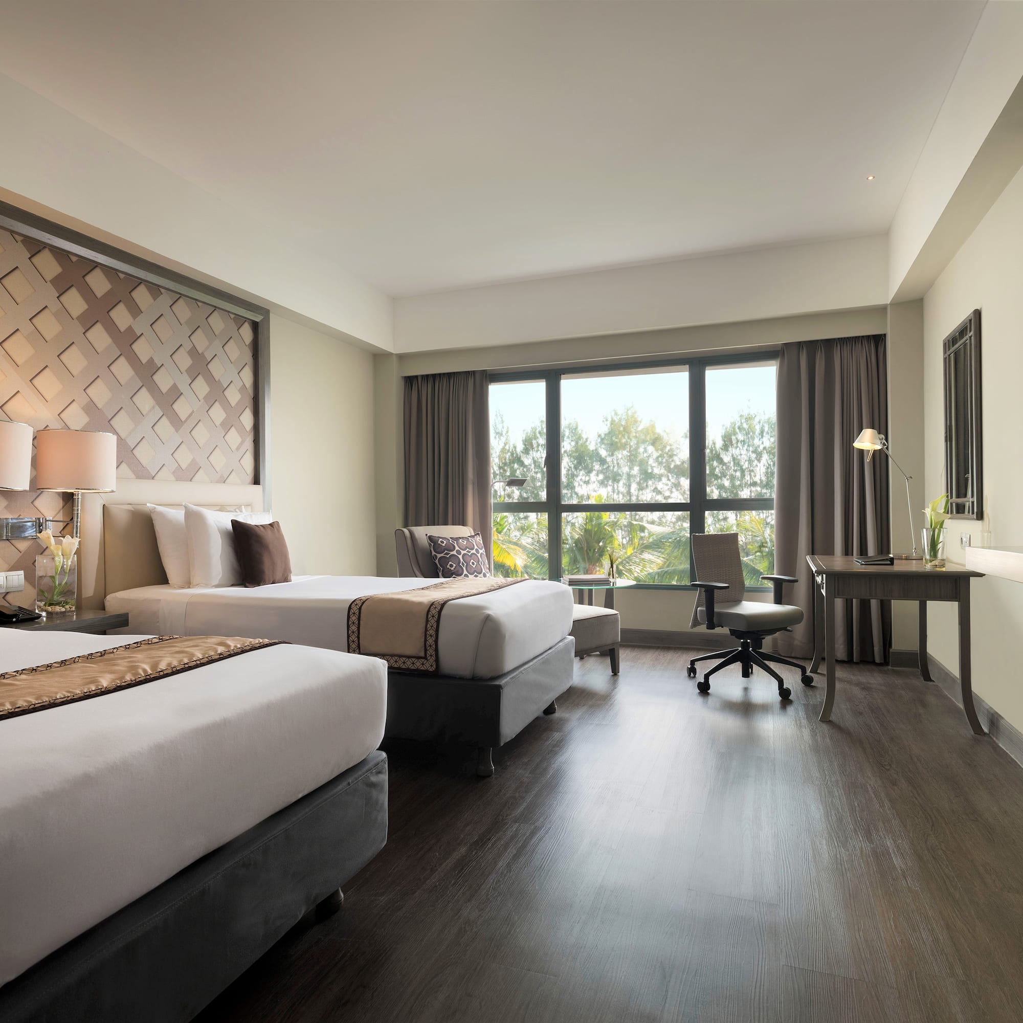 a room with two beds and a desk