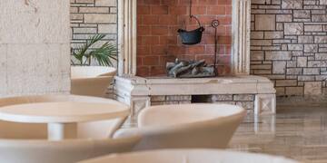 a fireplace with a pot from it