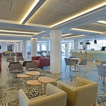 a room with chairs and tables