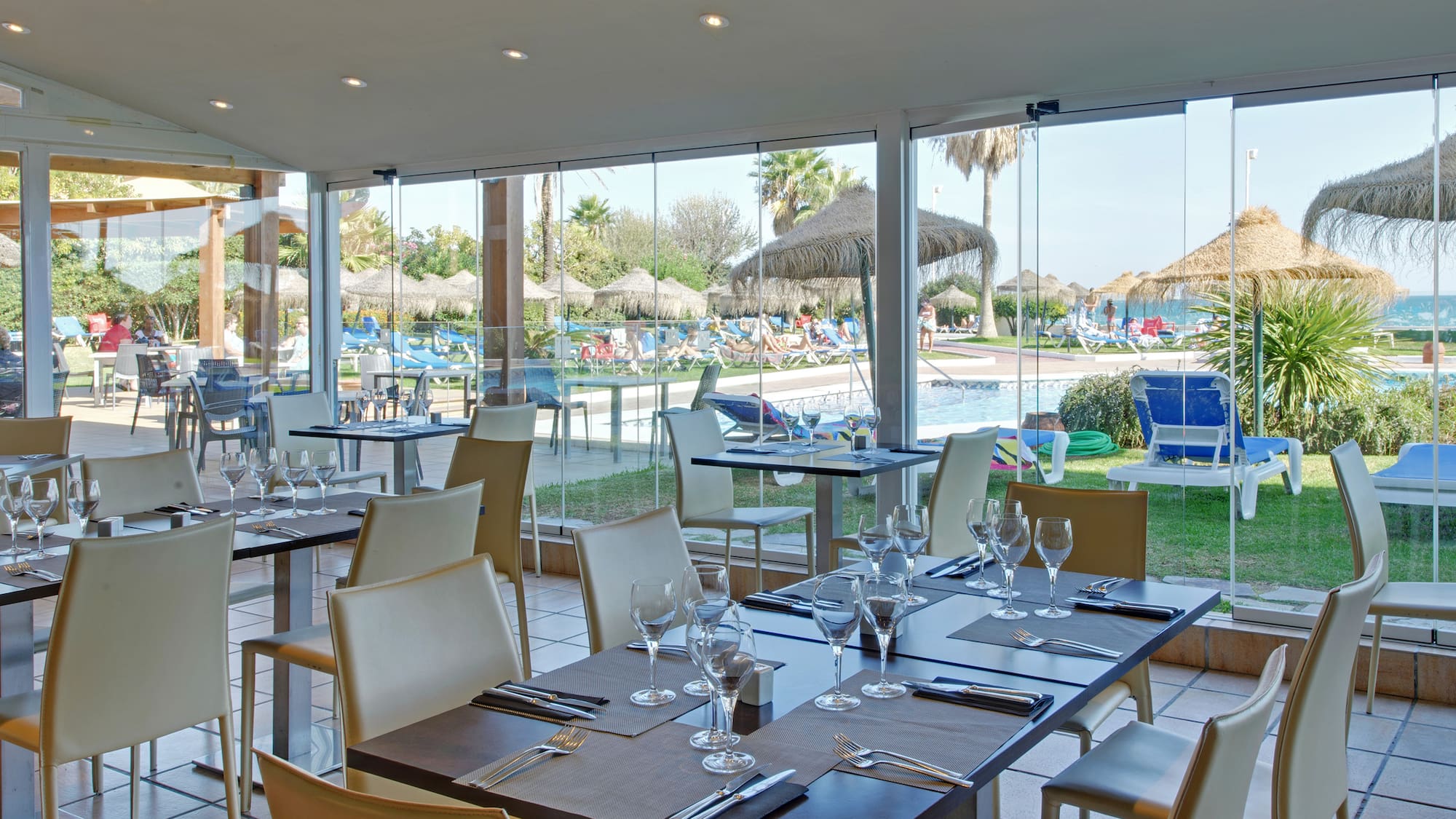 a restaurant with tables and chairs