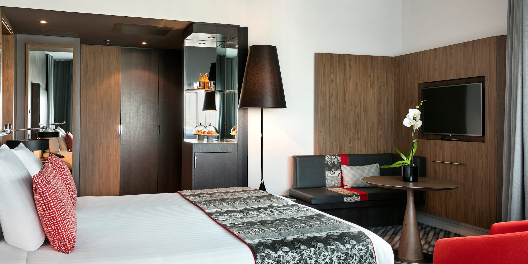 a room with a bed and a tv