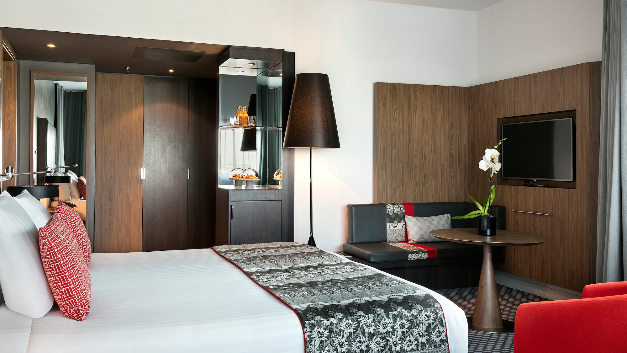 a room with a bed and a tv