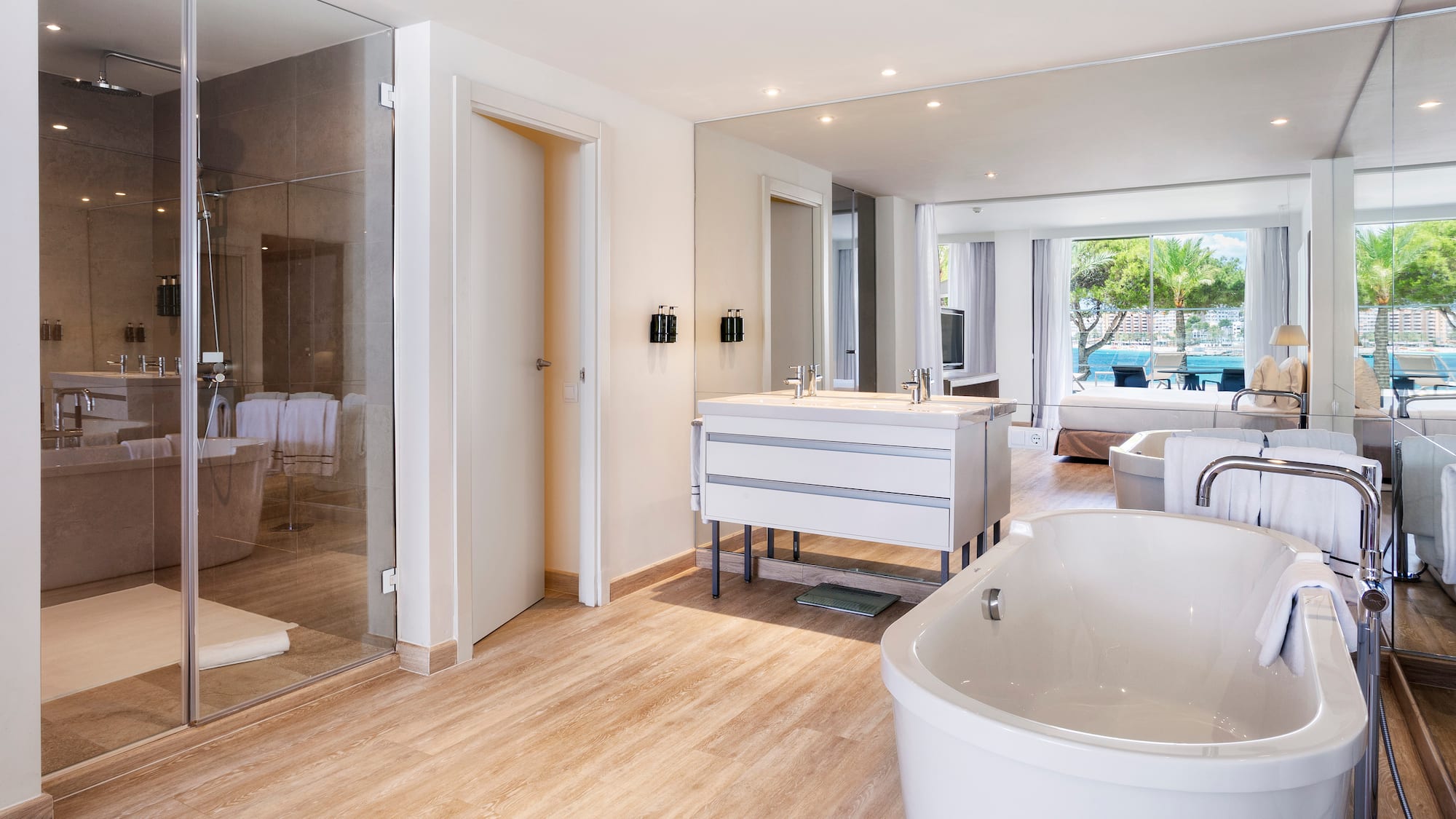 a bathroom with a tub and a shower
