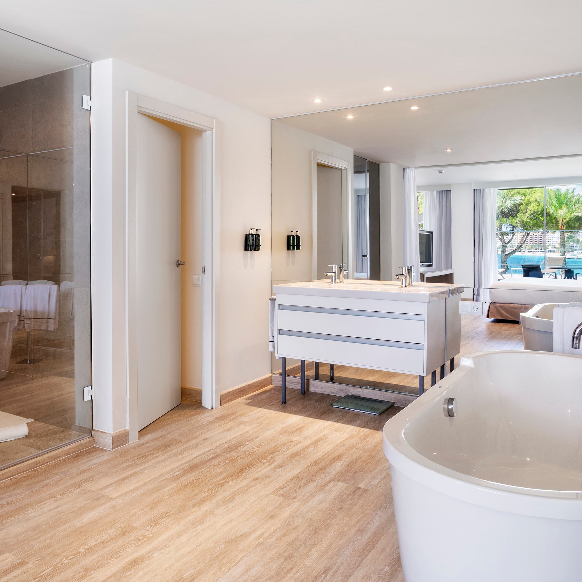 a bathroom with a tub and a shower