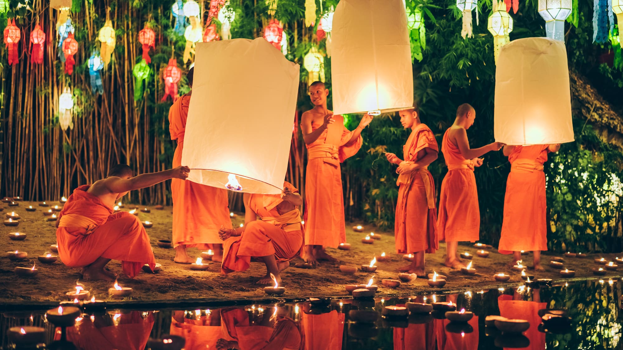 a group of people holding lanterns