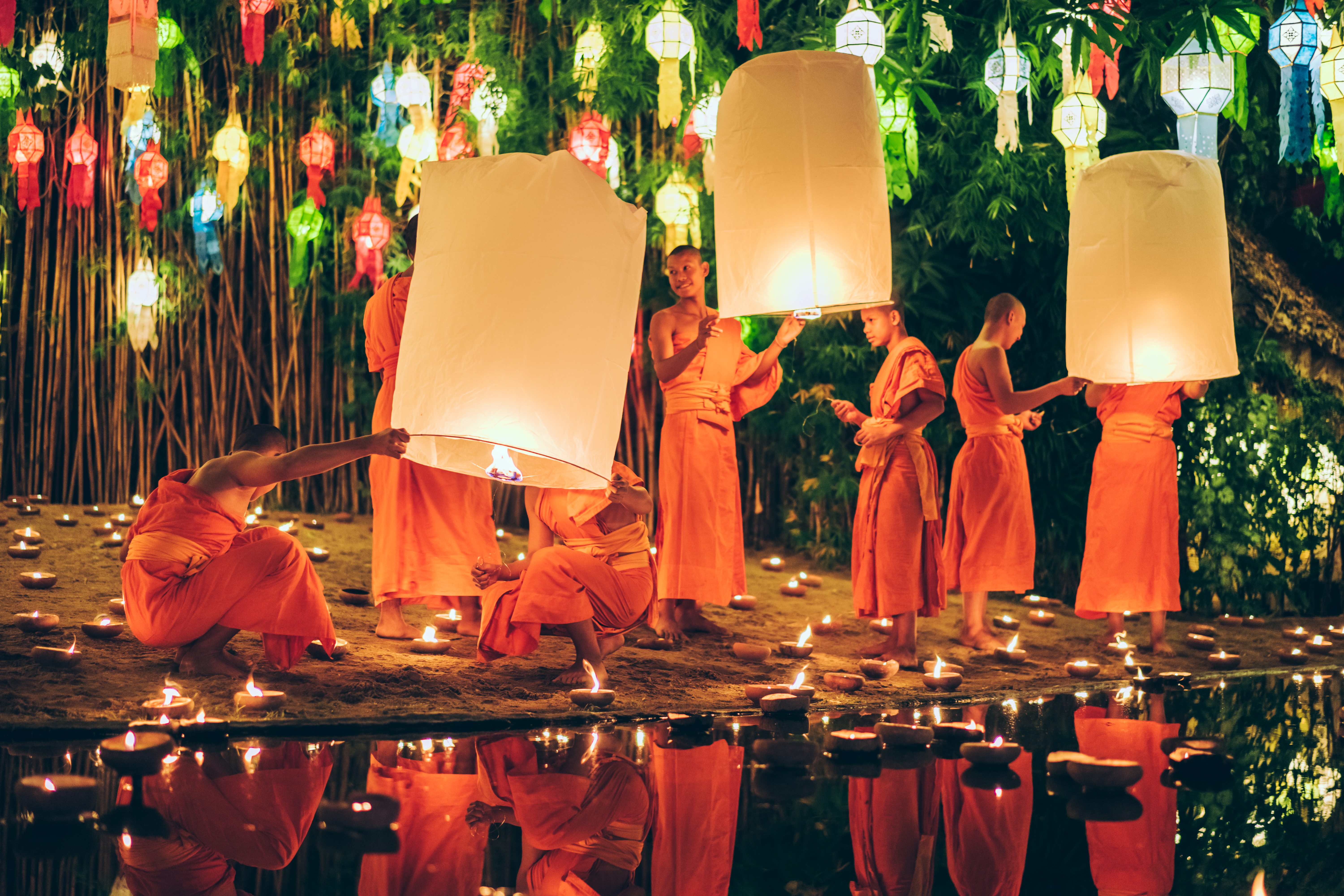 a group of people holding lanterns