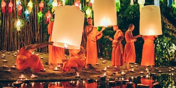 a group of people holding lanterns