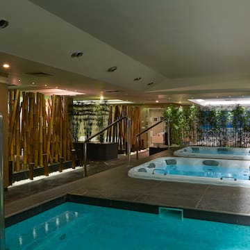 a indoor pool with hot tubs.