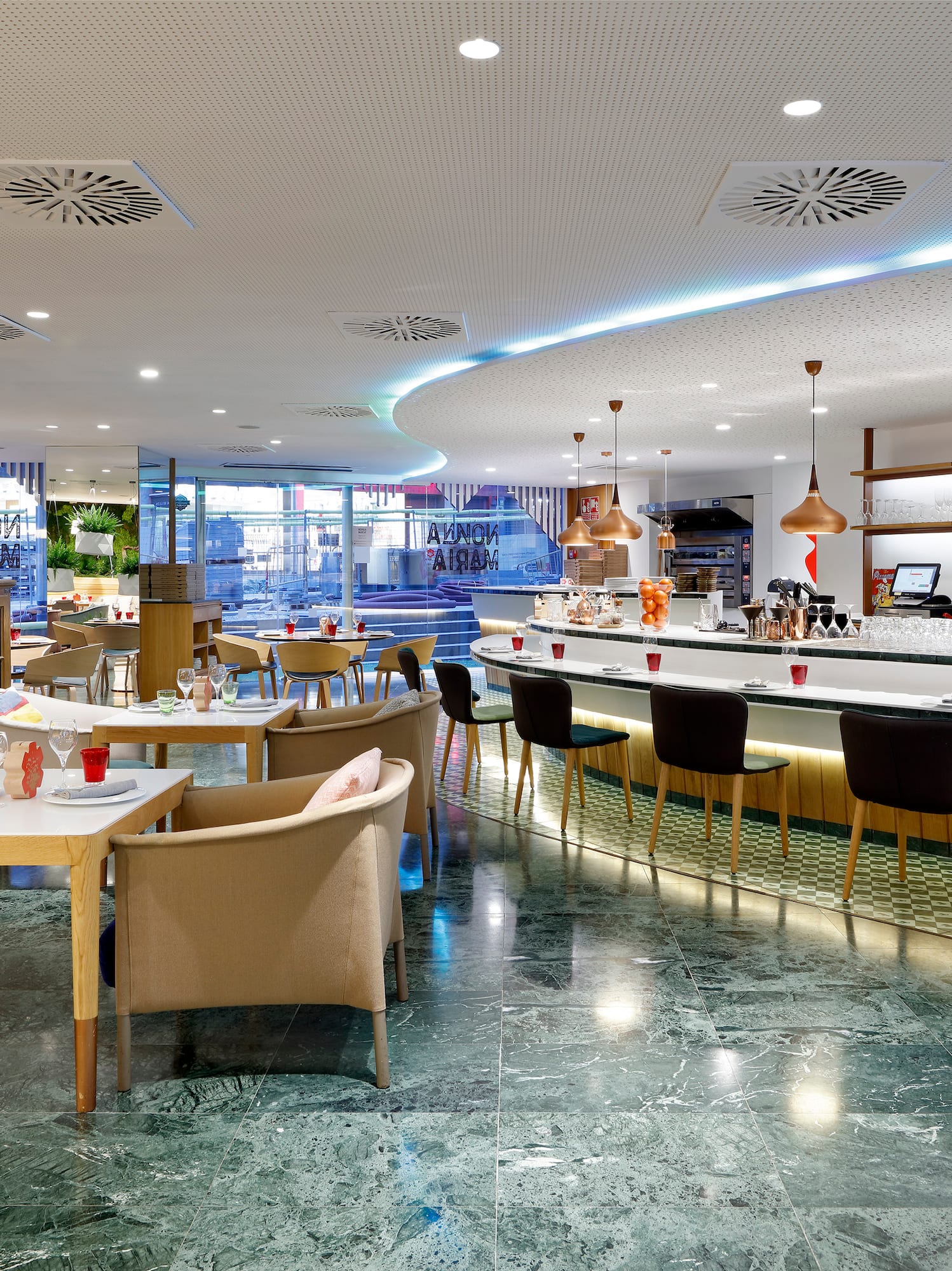a restaurant with tables and chairs.