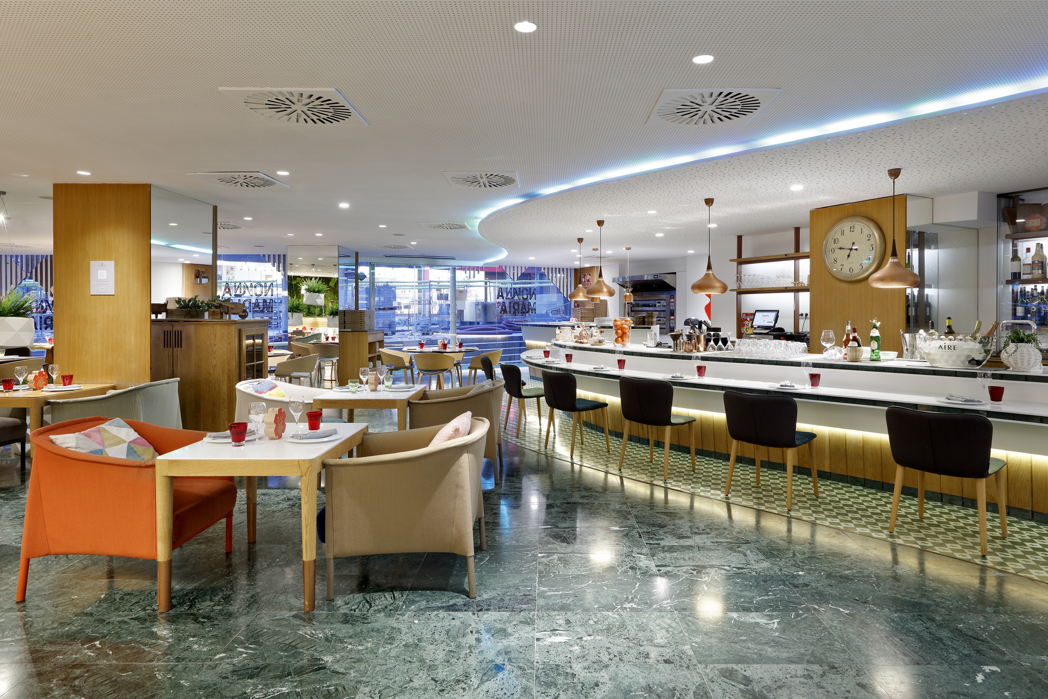 a restaurant with tables and chairs.