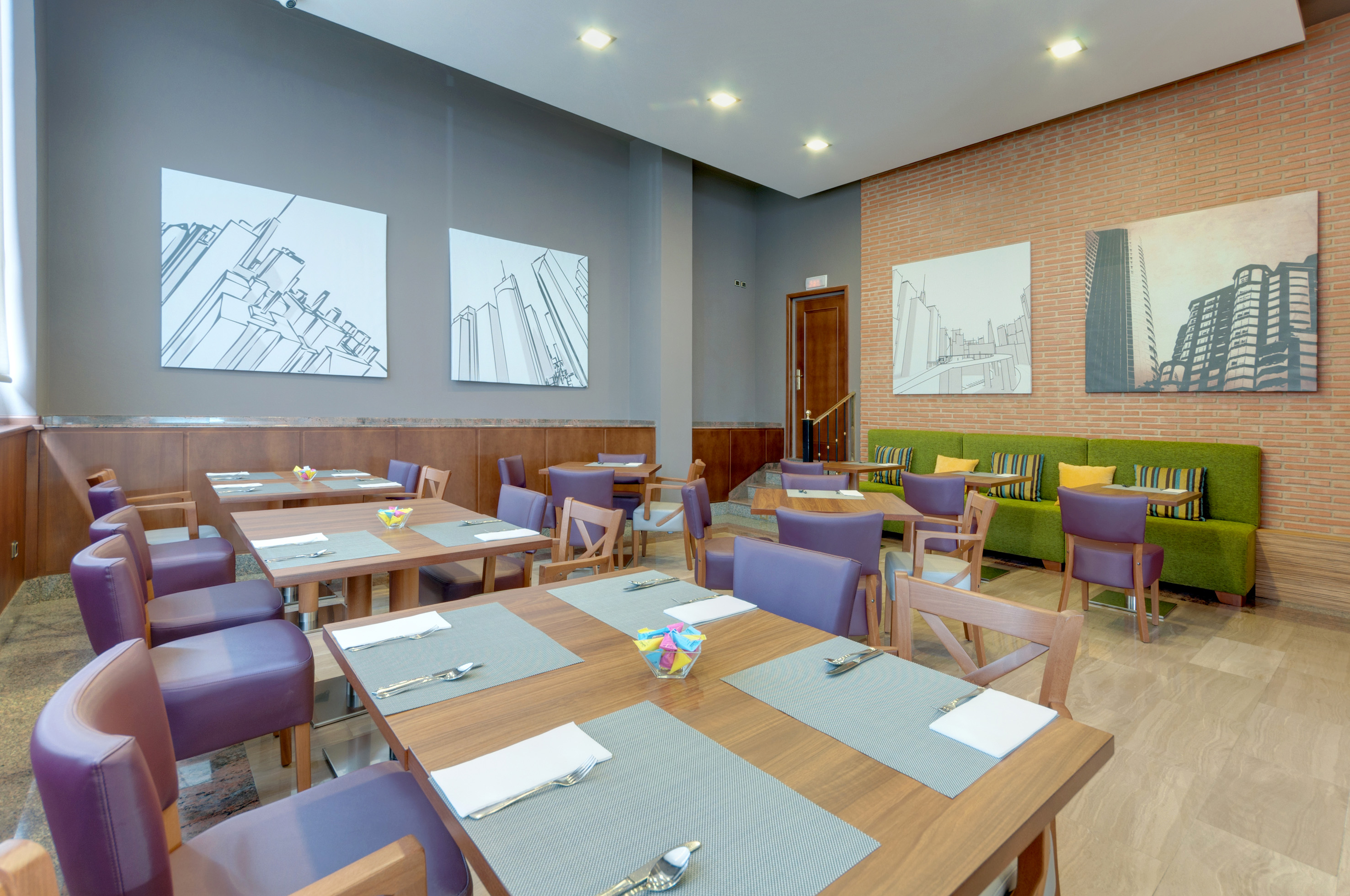 Modern restaurant dining with wooden tables, purple chairs, green bench, cityscape art.