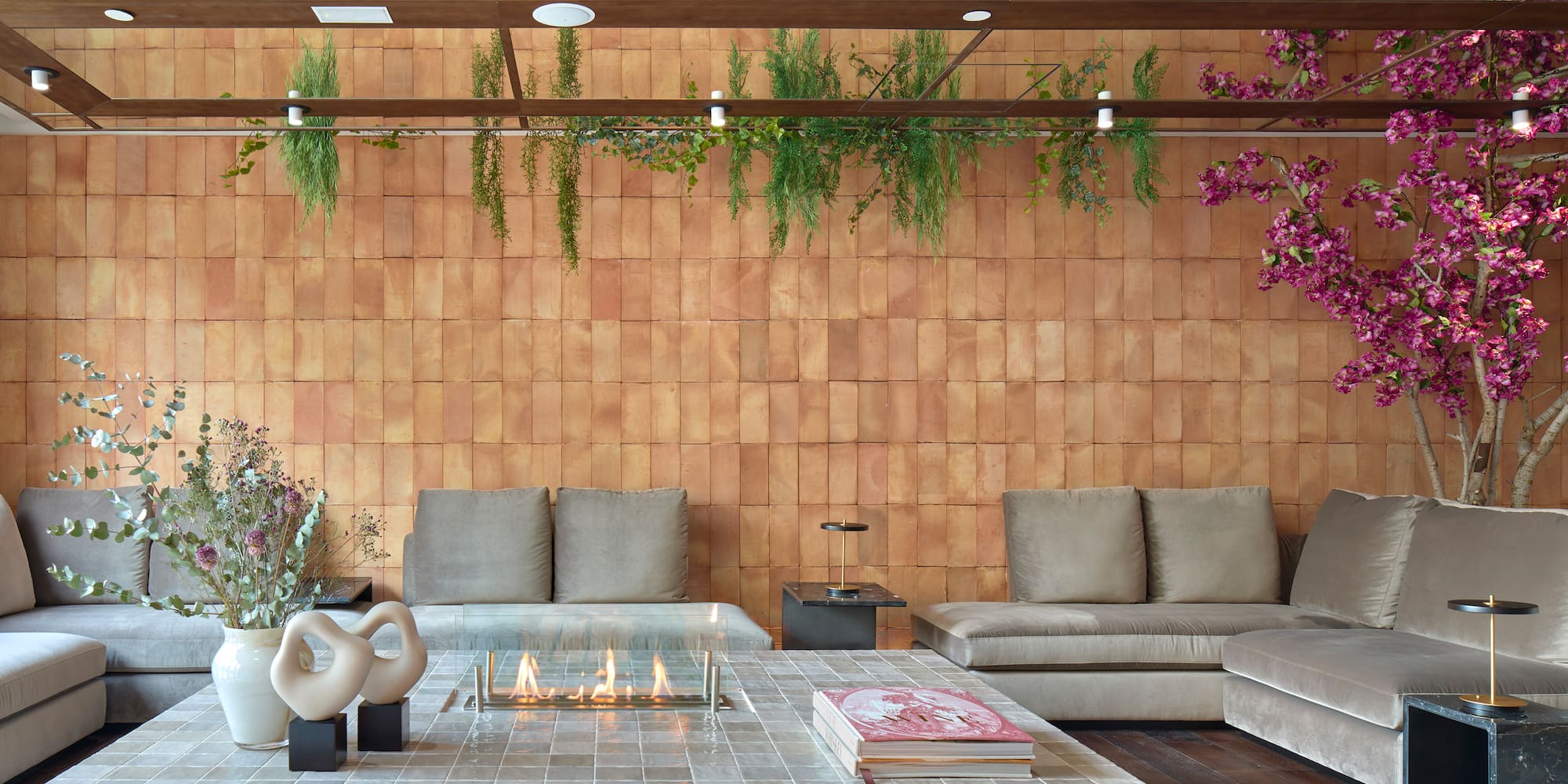 a living room with a fireplace and couches