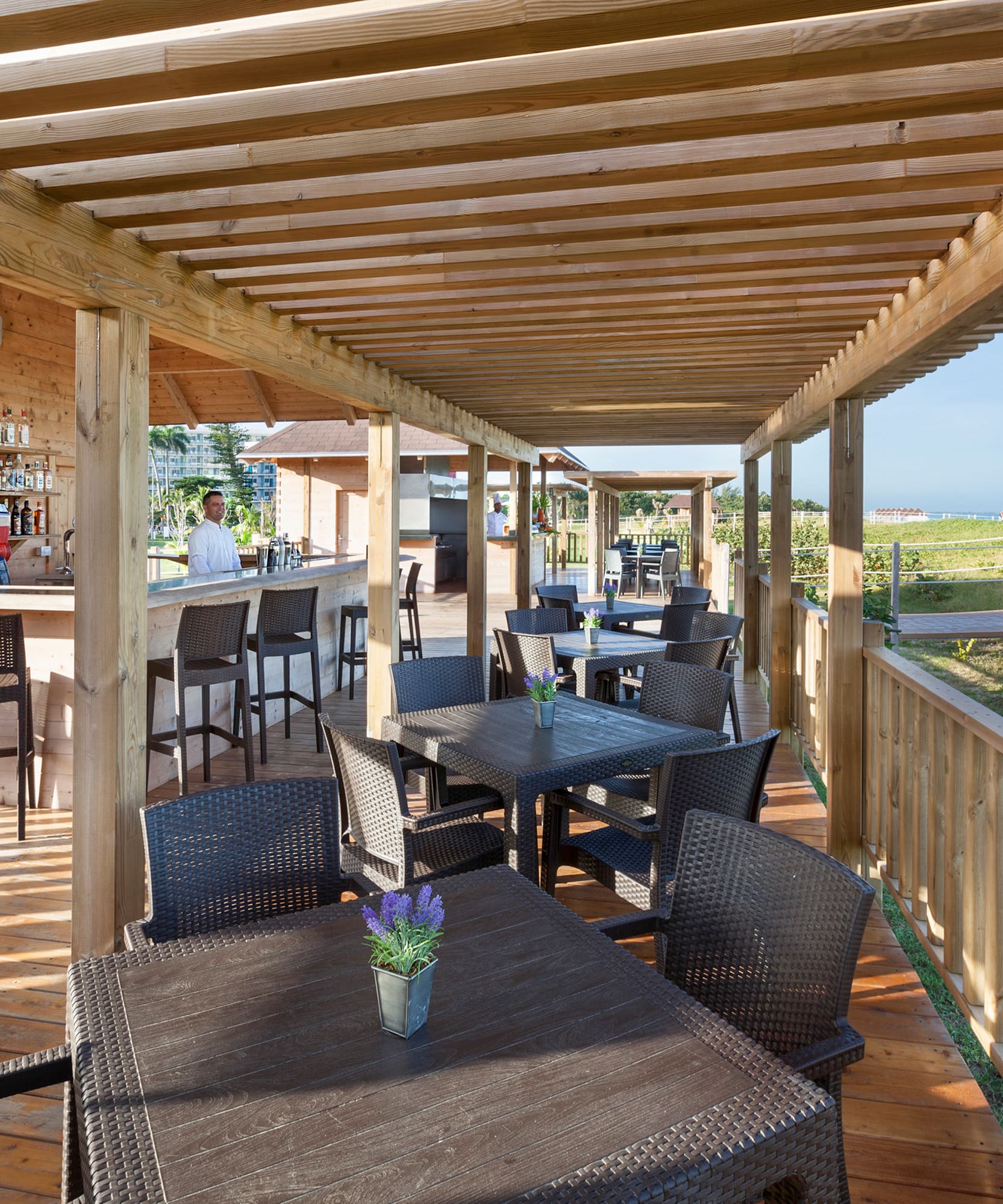 a patio with tables and chairs