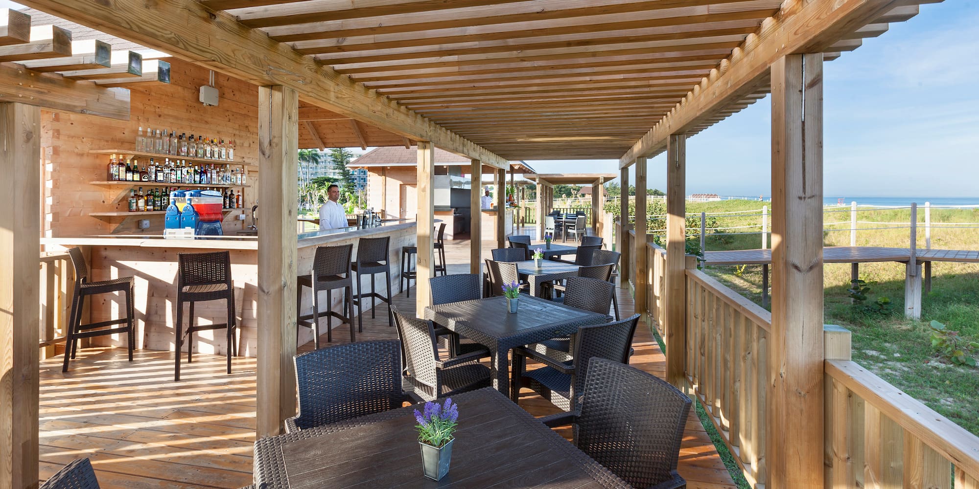 a patio with tables and chairs
